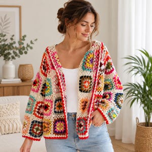May include: A long-sleeved cardigan made of multi-colored crochet granny squares in shades of red, pink, yellow, blue, green, and purple, joined by an off-white yarn. The open-front garment features a V-neckline and a vibrant, textured pattern.