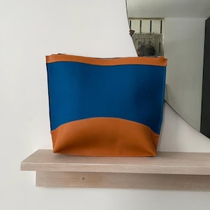 Bolso tipo cartera de lana y cuero