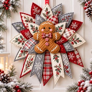 May include: A fabric star-shaped wall hanging featuring a central gingerbread person ornament. The petals are crafted from quilted fabric in red, grey, and cream, decorated with holly, berries, plaid patterns, and white snowflake embroidery.