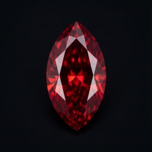 May include: A marquise-cut gemstone with a deep, vibrant red color and a faceted surface that reflects light. The stone features a pointed oval shape with symmetrical facets radiating from the center, set against a solid black background.