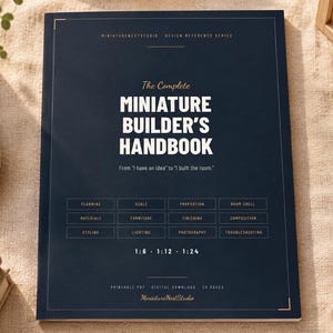 May include: A dark blue book titled The Complete Miniature Builder's Handbook with white text and gold accents. The cover lists topics including planning, scale, proportion, materials, furniture, lighting, and photography, with 1:6, 1:12, and 1:24 scales.