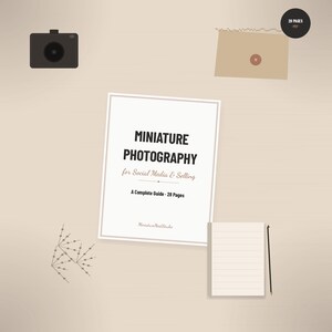 May include: A 28-page PDF guide titled Miniature Photography for Social Media & Selling, accompanied by a black camera icon, a tan envelope with a circular seal, a lined notepad, a pencil, and a small decorative branch illustration.