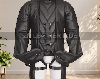 May include: A black leather restraint suit featuring a high collar with a metal ring, long sleeves with integrated mittens, and a quilted front panel. The garment includes adjustable buckled straps across the chest and legs with ZR LEATHER HIDE text.