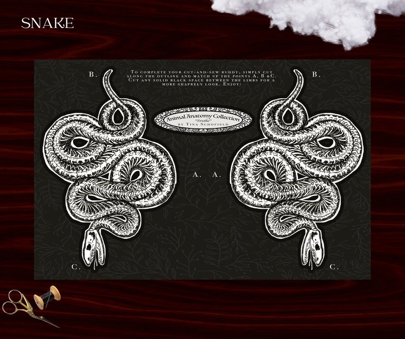 May include: Black and white snake cut-and-sew pattern with the text "SNAKE" at the top. The pattern includes instructions to cut along the outline and match points A, B, and C. The design is part of the "Animal Anatomy Collection" by Tina Schofield.