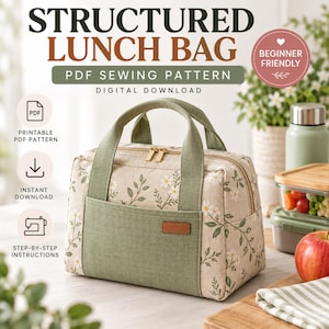Puede incluir: Un patrón de costura para bolsa de almuerzo estructurada en tela beige con estampado de margaritas blancas y hojas verdes, con paneles de tela verde salvia, dos asas superiores, un bolsillo frontal y cremallera dorada.