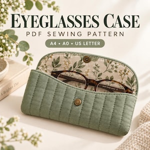 May include: A quilted sage green eyeglasses case with a metal snap closure, featuring a floral interior lining and containing tortoiseshell glasses. The text reads: EYEGLASSES CASE PDF SEWING PATTERN A4 A0 US LETTER.