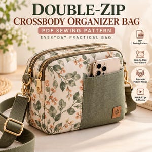 Puede incluir: Un bolso bandolera organizador con doble cremallera que presenta un estampado floral de hojas verdes y bayas naranjas sobre fondo crema, combinado con un bolsillo liso de color verde oliva. Incluye una correa ajustable verde oliva y herrajes dorados.