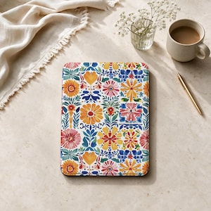 May include: A rectangular tablet case featuring a vibrant, repeating floral pattern with watercolor-style illustrations of orange, yellow, pink, and blue flowers and green foliage arranged in a symmetrical, grid-like botanical design.