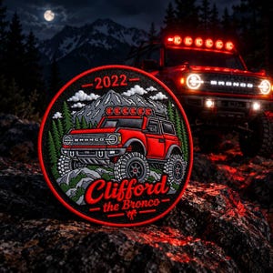 May include: A circular embroidered patch featuring a red Ford Bronco vehicle on a rocky mountain trail with green pine trees and a night sky. The text 2022 is at the top, and the text Clifford the Bronco is at the bottom in red lettering.