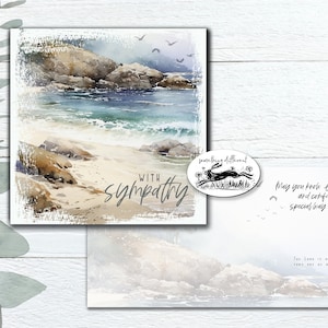 May include: A sympathy card featuring a watercolour painting of a beach scene with rocks, waves, and a sandy shore. The card has the words "with sympathy" written on it. The card also includes a small image of a rabbit running through a field of flowers with the words "something different" written above it.