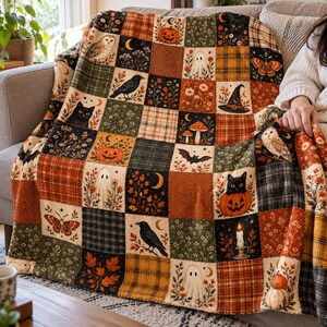 May include: A patchwork throw blanket featuring a repeating grid of autumn-themed squares. Patterns include black cats, pumpkins, owls, ghosts, ravens, bats, mushrooms, butterflies, candles, crescent moons, and plaid or floral textures in orange, green, and brown.
