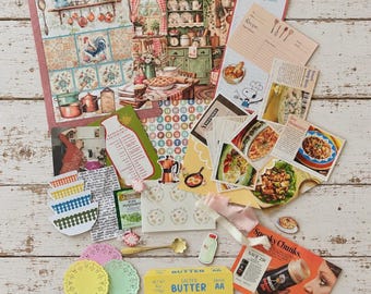 Könnte beinhalten: Eine Sammlung von Küchen-Papierwaren, darunter Rezeptkarten, Einkaufslisten, Vintage-Lebensmittelwerbung, ausgestanzte Papierschalen, dekorative Deckchen, ein goldfarbener Löffel und eine Packung mit 113g gesalzener Butter.