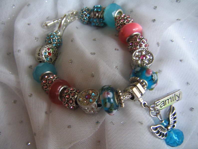 by TLCcharms FAMILY ANGEL...Silver Charm Bracelet with Aqua and Pink European Beads..