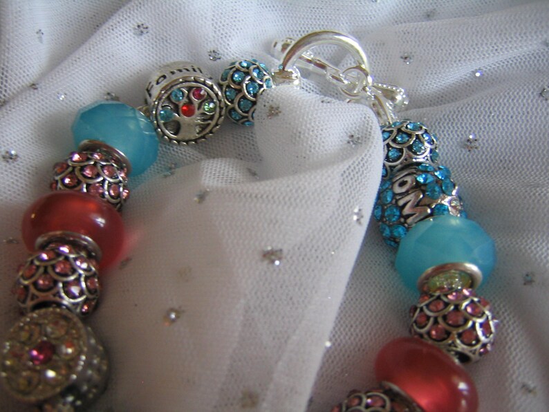 by TLCcharms FAMILY ANGEL...Silver Charm Bracelet with Aqua and Pink European Beads..