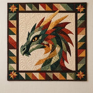 May include: A square fabric wall hanging featuring a pieced dragon head design in shades of green, red, and gold. The dragon is set against a cream background with feather quilting patterns, framed by a border of triangles and star corners.