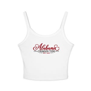 May include: A white sleeveless crop top featuring the red script text Alabama, the grey text CRIMSON TIDE, and the text EST. 1832 in red, centered on the chest. The garment has a scoop neckline and thin shoulder straps, providing a simple design.