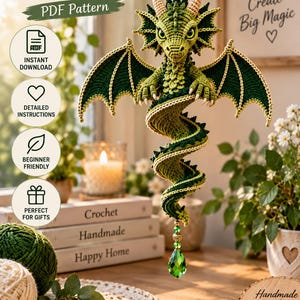 May include: A crochet spiral dragon hanging ornament featuring green yarn, textured scales, and large wings. The dragon is suspended by a gold chain with a green crystal drop. Text includes "Crochet Spiral Dragon PDF Pattern", "Instant Download", "Detailed Instructions", "Beginner Friendly", "Perfect for Gifts", "Small Stitches Create Big Magic", "Crochet Handmade Happy Home", "Handmade with Love", and "Crochet Create Be Happy".