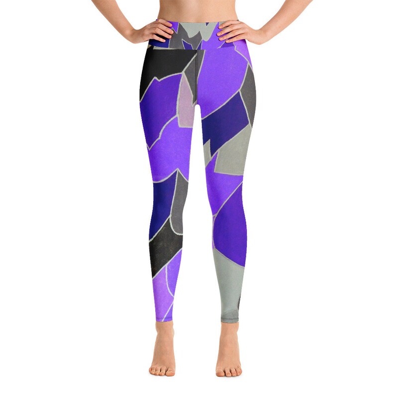 May include: Purple, black, and gray patterned yoga leggings. The leggings have a high waist and a tight fit.