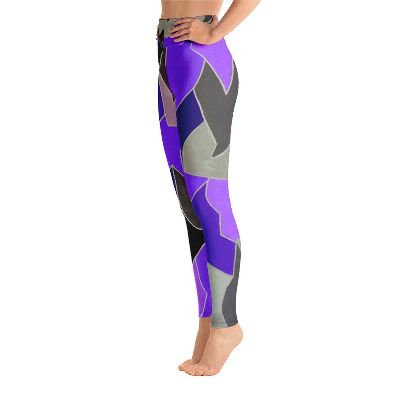 May include: Purple, black, and gray patterned yoga leggings. The leggings have a high waist and a tight fit.