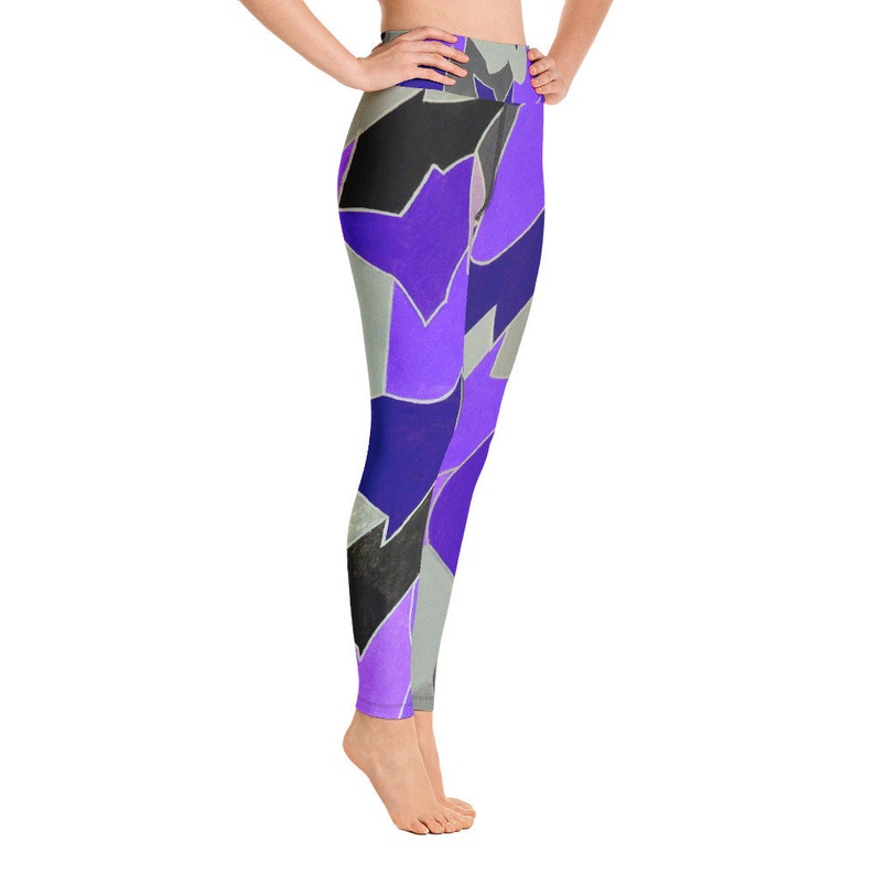 May include: Purple, blue, and black patterned yoga leggings with a high waist.