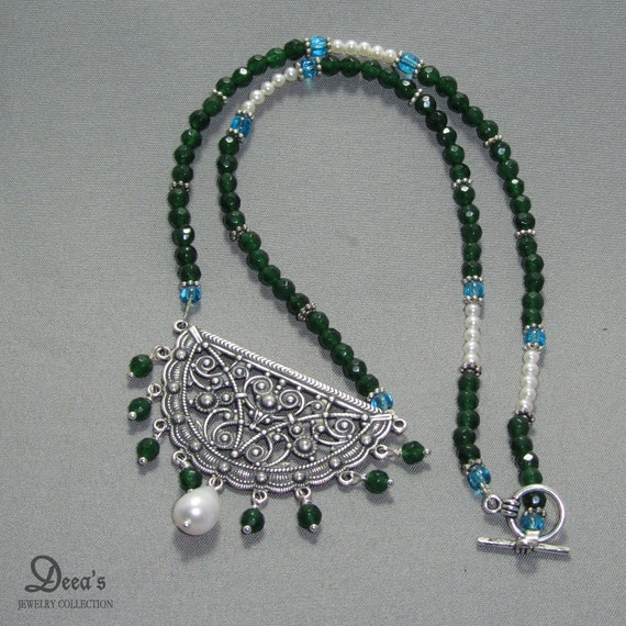 Items similar to Beaded Necklace with Sterling Silver Pendant on Etsy