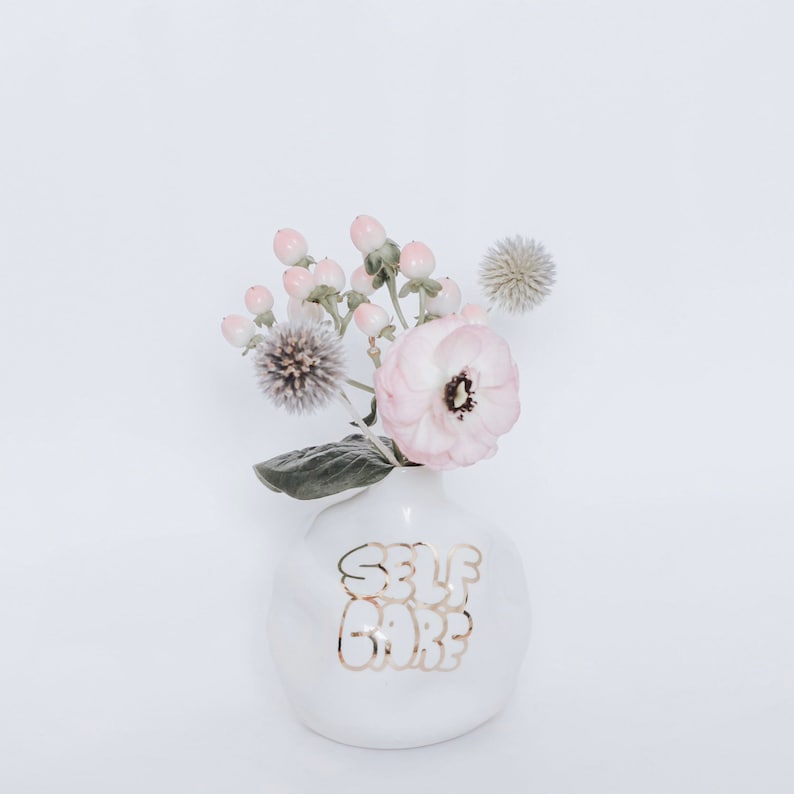 Self Care Handthrown and distorted ceramic budvase Porcelain clay and white glaze 22k Gold lettering