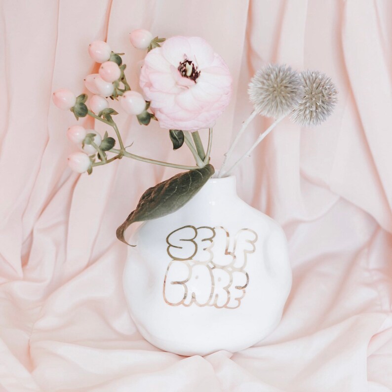 Self Care Handthrown and distorted ceramic budvase Porcelain clay and white glaze 22k Gold lettering