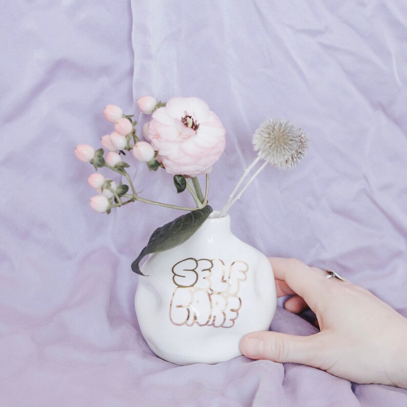 Self Care Handthrown and distorted ceramic budvase Porcelain clay and white glaze 22k Gold lettering