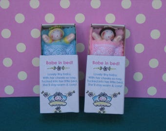 Pair of Baby dolls in matchbox beds