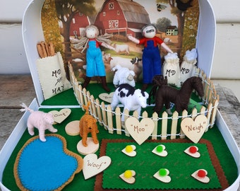 Old MacDonald's farm in a suitcase with dolls, animals and farm features