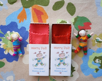 Pair of Worry dolls in matchbox beds