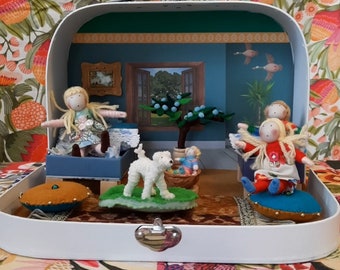 Doll House in a suitcase with dolls and furniture