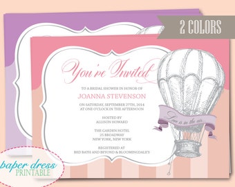 May include: A pink and purple bridal shower invitation with a hot air balloon graphic and the text "You're Invited" and "Love is in the air..."