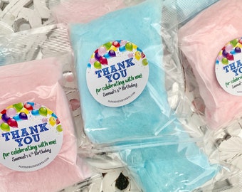 May include: Pink and blue bags of cotton candy with round stickers that say "Thank You for celebrating with me! Samuel's 5th Birthday" with colorful balloons and the website "paperdressevents.com"
