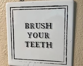 Black and White  Metal Brush Your Teeth Bathroom Sign With Metal Chain for Hanging Measures 7 by 7 Inches