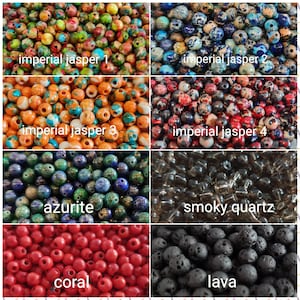 May include: Assortment of colorful gemstone beads, including imperial jasper, azurite, smoky quartz, coral, and lava. The beads are arranged in rows, with each row labeled with the type of bead.