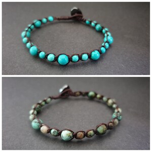 May include: Two turquoise beaded bracelets with brown cord. The top bracelet has smooth turquoise beads. The bottom bracelet has turquoise beads with brown and white markings.