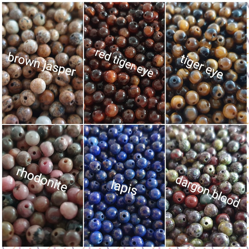 May include: Assortment of gemstone beads in various colors, including brown jasper, red tiger eye, tiger eye, rhodonite, lapis lazuli, and dragon blood.