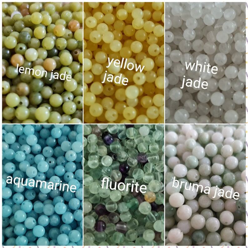 May include: Assortment of round beads in various colors, including lemon jade, yellow jade, white jade, aquamarine, fluorite, and bruma jade.