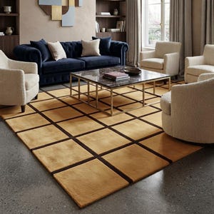 May include: A large rectangular area rug featuring a grid pattern of mustard yellow squares separated by dark brown lines. The rug is positioned on a gray floor beneath a square coffee table with a marble top and a gold metal frame.