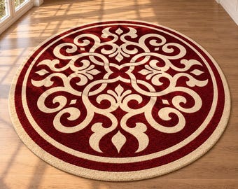Op de afbeelding: Een rond vloerkleed met een dieprode achtergrond en een opvallend, crèmekleurig symmetrisch krulpatroon. Het ontwerp bestaat uit ingewikkelde, onderling verbonden, bloemachtig geïnspireerde rondingen en versieringen, omlijst door een effen crèmekleurige rand.