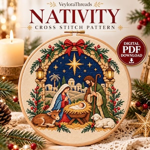 May include: A cross stitch pattern titled VeyloraThreads NATIVITY CROSS STITCH PATTERN featuring a nativity scene with a central star, figures, and animals inside a wooden hoop, marked as a digital PDF download.