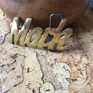 MARK  Belt Buckle Solid Brass  1970's  NOS