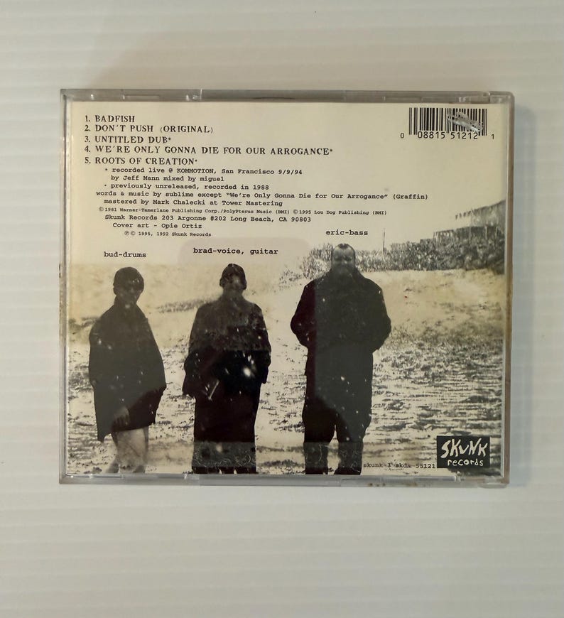 May include: A CD case featuring a black and white image of three figures. The CD case includes a tracklist with song titles like "Badfish" and "Don't Push." The Skunk Records logo is visible.