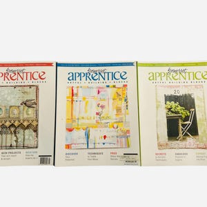 May include: Three magazines titled "Somerset Apprentice" with colorful covers. The magazines feature artistic designs, including collages, floral arrangements, and a garden scene. Text includes "Details & Steps," "New Projects," and "Secrets."