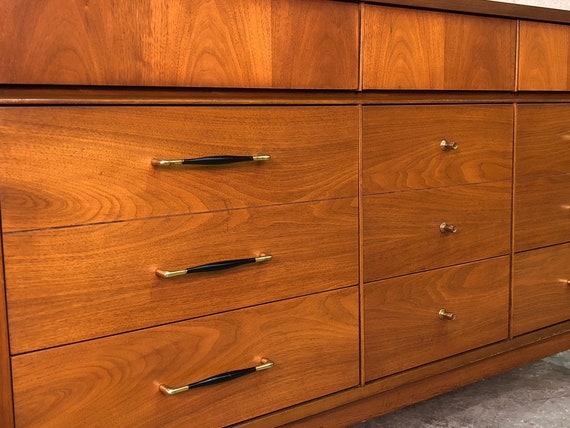 A unique design with curved front drawers, stubby tapered legs, and a charming walnut finish. broyhill mid century modern walnut 9 drawer dresser credenza great tv stand