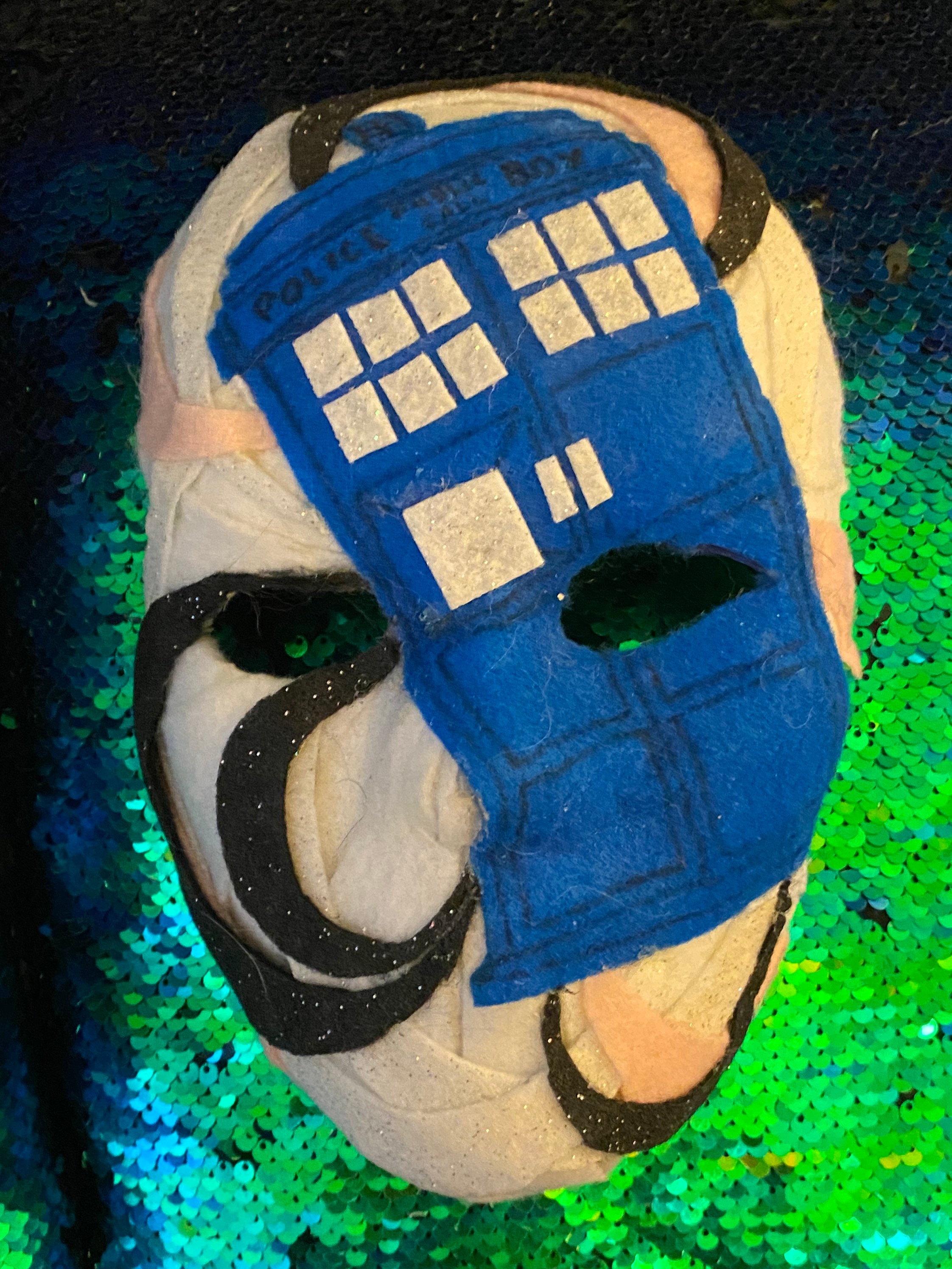 Two decorative masks themed Etsy