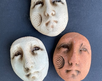 Three Rune and Relic Earthenware Faces
