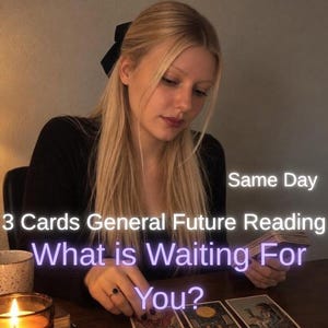 May include: A tarot card reading service featuring the text Same Day 3 Cards General Future Reading What is Waiting For You? The image shows a person with long blonde hair wearing a black top, holding a deck of tarot cards near three cards.