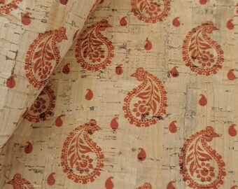 May include: Cork fabric with a paisley pattern in shades of orange and brown. The fabric has a natural, textured look.